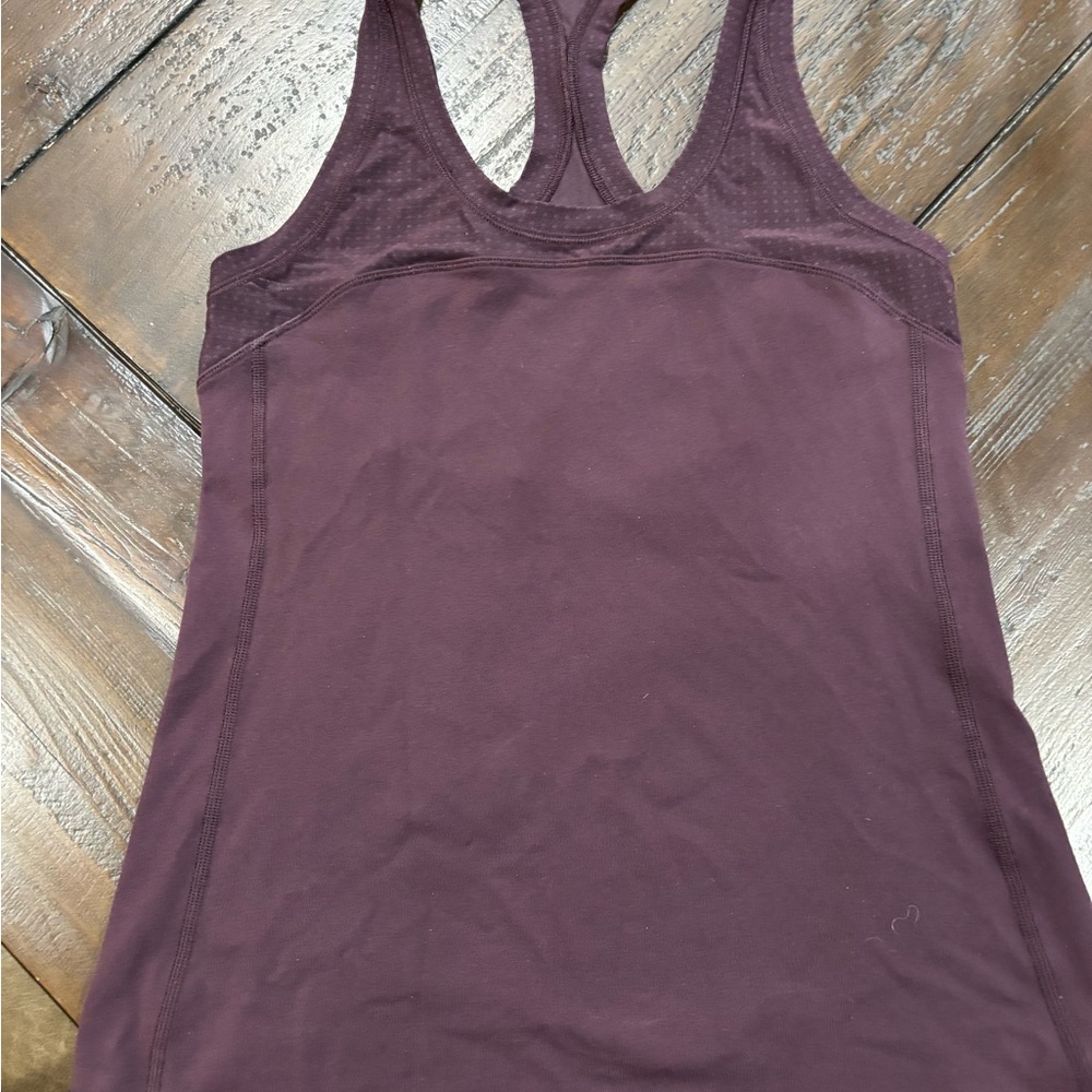 Lulu lemon eggplant colored muscle  Tank Top. This is cut longer then new tanks